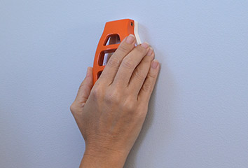 Level nails against the wall